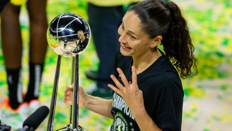 Oct 6, 2020; Bradenton, Florida, USA; Seattle Storm guard Sue Bird (10) poses with the championship trophy after winning the 2020 WNBA Finals at IMG Academy. Mandatory Credit: Mary Holt-USA TODAY Sports