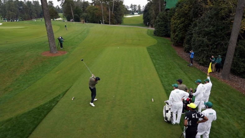 Nov 14, 2020; Augusta, Georgia, USA; Paul Casey plays his shot from the 18th tee during continuation of the second round of The Masters golf tournament at Augusta National GC. Mandatory Credit: Rob Schumacher-USA TODAY Sports