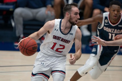 Jan 16, 2021; Moraga, California, USA; St. Mary's Gaels guard Tommy Kuhse (12) drives the ball against the Gonzaga Bulldogs during the first half at McKeon Pavilion. Mandatory Credit: Stan Szeto-USA TODAY Sports