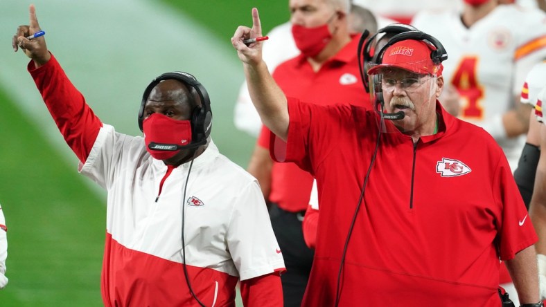 Nov 22, 2020; Paradise, Nevada, USA; Kansas City Chiefs offensive coordinator Eric Bieniemy (left) and coach Andy Reid react during the game against the Las Vegas Raiders at Allegiant Stadium. Mandatory Credit: Kirby Lee-USA TODAY Sports