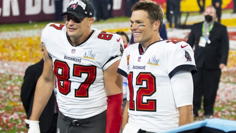 Feb 7, 2021; Tampa, FL, USA;  Tampa Bay Buccaneers quarterback Tom Brady (12) and tight end Rob Gronkowski (87) celebrate after beating the Kansas City Chiefs in Super Bowl LV at Raymond James Stadium.  Mandatory Credit: Mark J. Rebilas-USA TODAY Sports