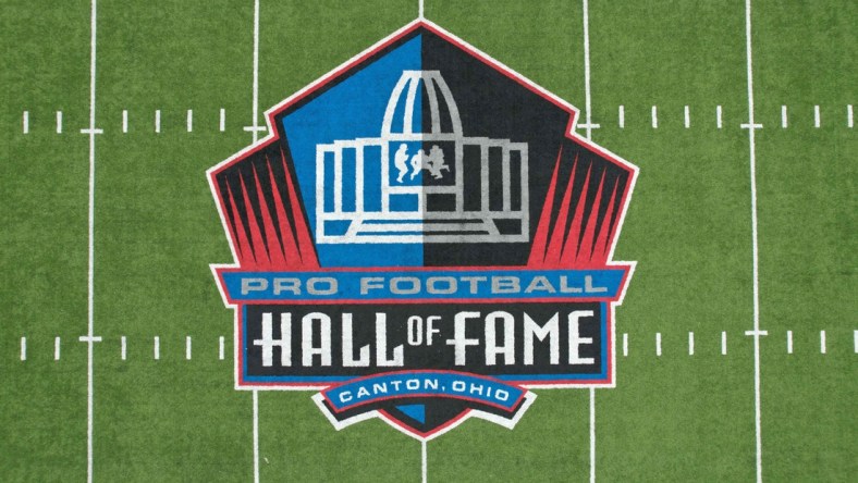 Apr 28, 2021; Canton, Ohio, USA; A detailed view of the Pro Football Hall of Fame logo at midfield of Tom Benson Hall of Fame Stadium (formerly Fawcett Stadium). Mandatory Credit: Kirby Lee-USA TODAY Sports