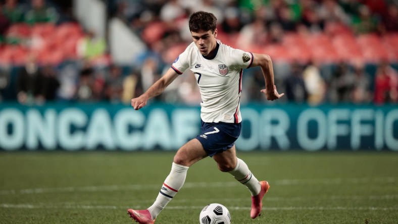 Jun 6, 2021; Denver, Colorado, USA; United States forward Gio Reyna (7) controls the ball in the second half against Mexico during the 2021 CONCACAF Nations League Finals soccer series final match at Empower Field at Mile High. Mandatory Credit: Isaiah J. Downing-USA TODAY Sports