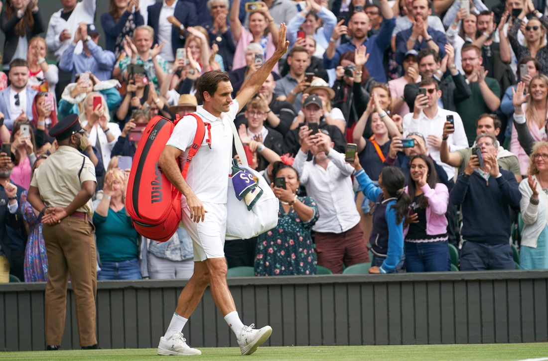 Jul 7, 2021; London, United Kingdom; Roger Federer (SUI) waving farewell to the Centre Court fans after losing to Hubert Hurkacz (POL) in the quarter finals at All England Lawn Tennis and Croquet Club. Mandatory Credit: Peter van den Berg-USA TODAY Sports