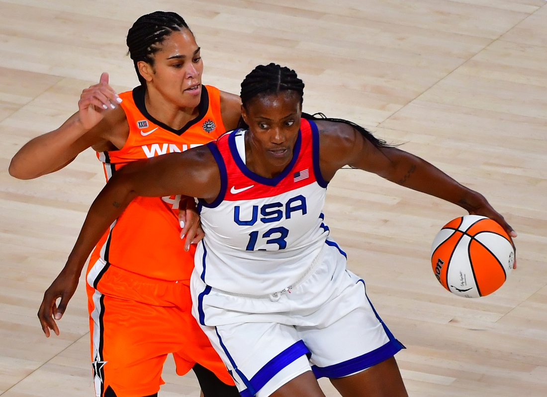 Jul 14, 2021; Las Vegas, NV, USA; Team USA center Sylvia Fowles (13) dribbles around WNBA All Star forward Brionna Jones (42) during the WNBA All Star Game at Michelob Ultra Arena at Mandalay Bay Resort. Mandatory Credit: Stephen R. Sylvanie-USA TODAY Sports