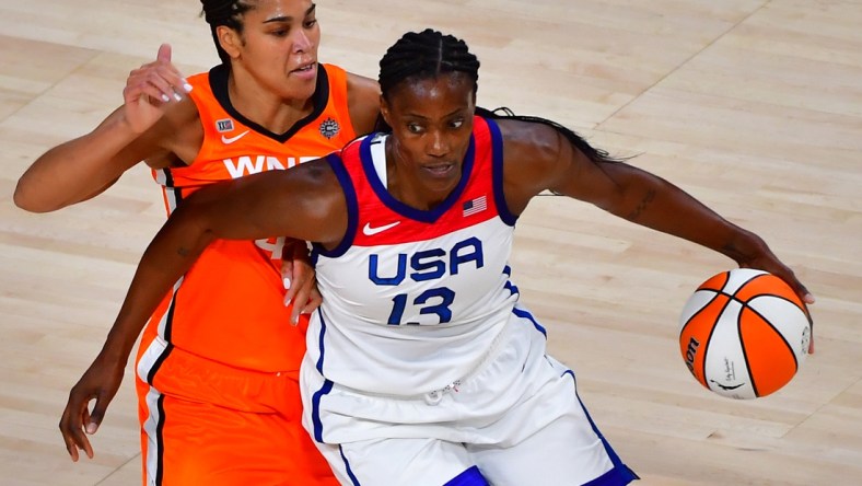 Jul 14, 2021; Las Vegas, NV, USA; Team USA center Sylvia Fowles (13) dribbles around WNBA All Star forward Brionna Jones (42) during the WNBA All Star Game at Michelob Ultra Arena at Mandalay Bay Resort. Mandatory Credit: Stephen R. Sylvanie-USA TODAY Sports