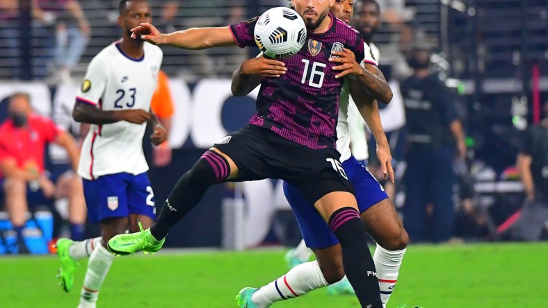 Aug 1, 2021; Las Vegas, Nevada, USA; Mexico midfielder Hector Herrera (16) looks to control a ball as USA midfielder Ginaluca Busio (6) defends on the play during the CONCACAF Gold Cup final soccer match at Allegiant Stadium. Mandatory Credit: Stephen R. Sylvanie-USA TODAY Sports