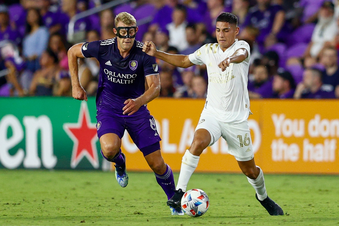 Jul 30, 2021; Orlando, Florida, USA;  Atlanta United forward Erik Lopez (16) controls the ball past  Orlando City defender Robin Jansson (6) in the first half at Orlando City Stadium. Mandatory Credit: Nathan Ray Seebeck-USA TODAY Sports