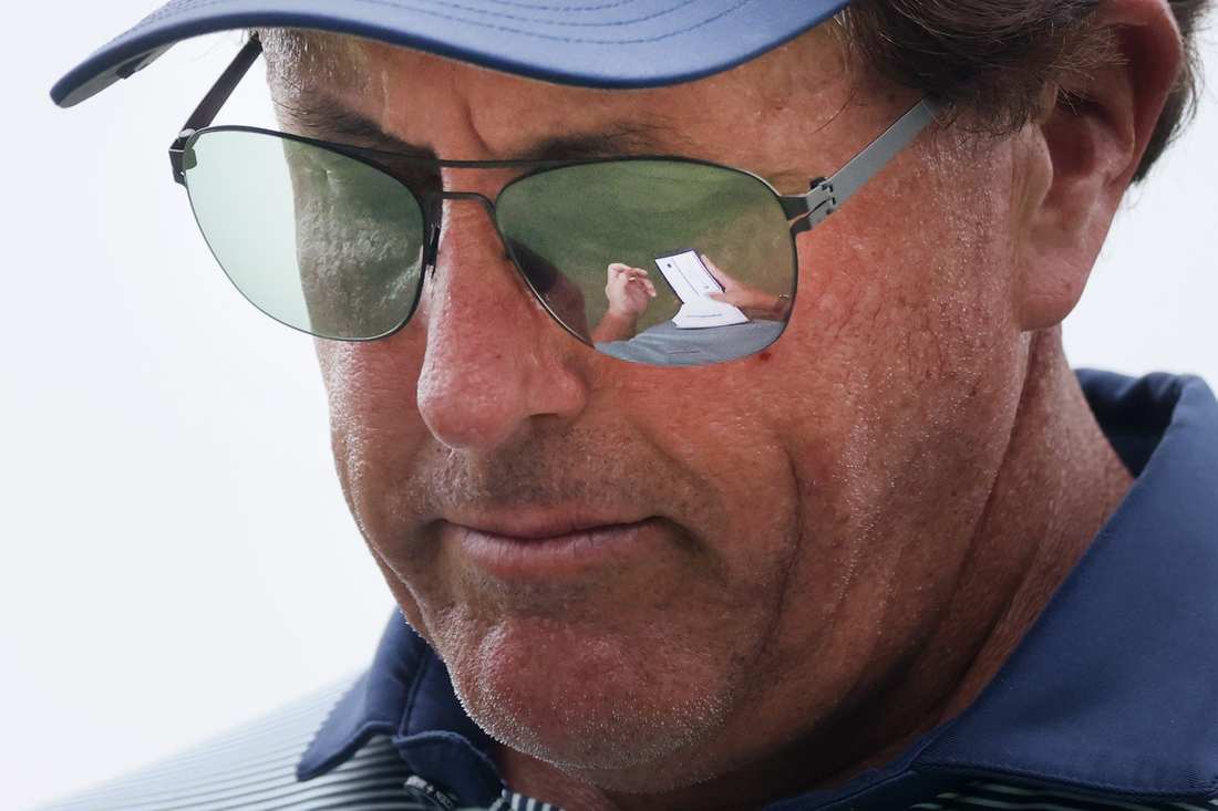 Phil Mickelson takes notes in his pad after playing Hole No. 16 during the second round of the World Golf Championships FedEx-St. Jude Invitational at TPC Southwind  in Memphis, Tenn. on Friday, August 6, 2021.

Jrca6762