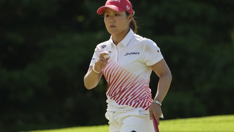 Aug 7, 2021; Tokyo, Japan; Nasa Hataoka (JPN) reacts after putting on the fourth hole during the final round of the women's individual stroke play of the Tokyo 2020 Olympic Summer Games at Kasumigaseki Country Club. Mandatory Credit: Michael Madrid-USA TODAY Sports