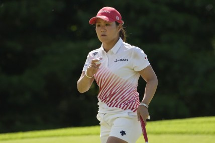 Aug 7, 2021; Tokyo, Japan; Nasa Hataoka (JPN) reacts after putting on the fourth hole during the final round of the women's individual stroke play of the Tokyo 2020 Olympic Summer Games at Kasumigaseki Country Club. Mandatory Credit: Michael Madrid-USA TODAY Sports