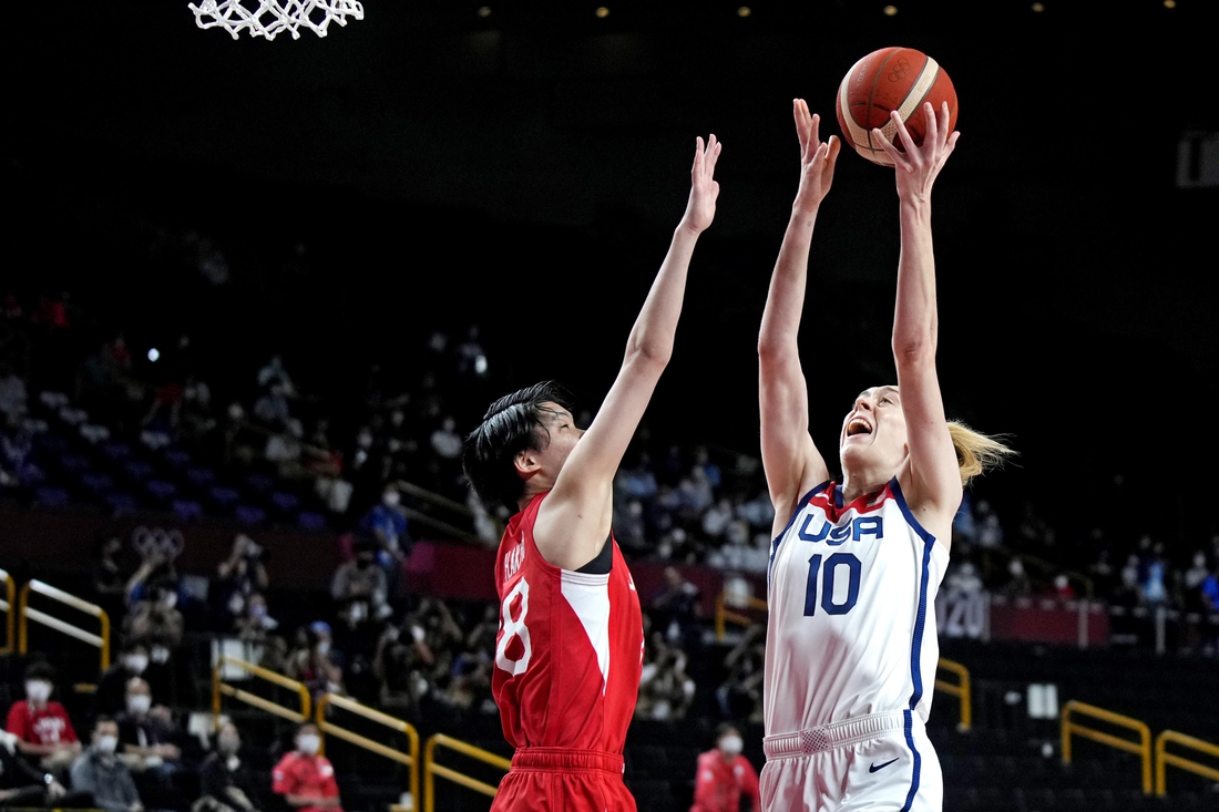 Aug 8, 2021; Saitama, Japan; United States forward Breanna Stewart (10) shoots the ball against Japan centre Maki Takada (8) in the women's basketball gold medal match during the Tokyo 2020 Olympic Summer Games at Saitama Super Arena. Mandatory Credit: James Lang-USA TODAY Sports