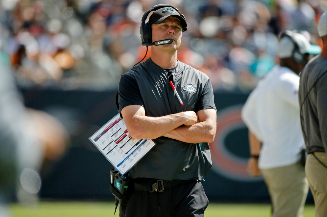 Aug 14, 2021; Chicago, Illinois, USA; Miami Dolphins defensive coordinator Josh Boyer watches the game against the Chicago Bears from the sideline during the second half at Soldier Field. Mandatory Credit: Jon Durr-USA TODAY Sports