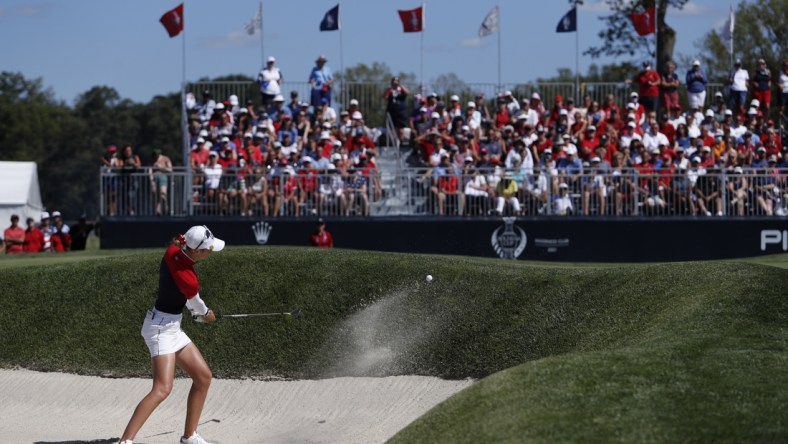 Sep 6, 2021; Toledo, Ohio, USA; Nelly Korda of Team USA hits a bunker shot on the twelfth hole during singles matches in the 2021 Solheim Cup at Invernes Club. Mandatory Credit: Raj Mehta-USA TODAY Sports