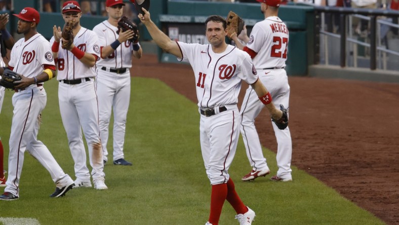 Oct 3, 2021; Washington, District of Columbia, USA; Washington Nationals first baseman Ryan Zimmerman (11) waves to the crowd after being removed from the game against the Boston Red Sox during the eighth inning at Nationals Park. Mandatory Credit: Geoff Burke-USA TODAY Sports