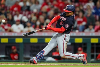 Sep 25, 2021; Cincinnati, Ohio, USA; Washington Nationals right fielder Juan Soto (22) hits a single against the Cincinnati Reds in the fourth inning at Great American Ball Park. Mandatory Credit: Katie Stratman-USA TODAY Sports