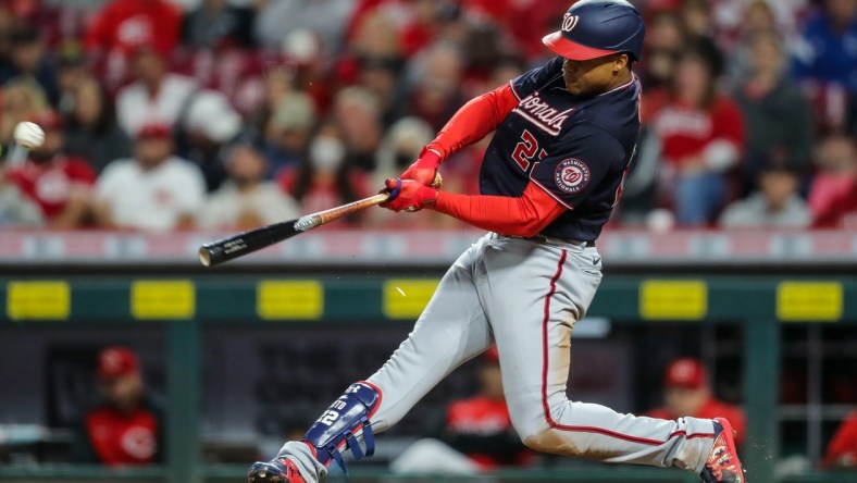 Sep 25, 2021; Cincinnati, Ohio, USA; Washington Nationals right fielder Juan Soto (22) hits a single against the Cincinnati Reds in the fourth inning at Great American Ball Park. Mandatory Credit: Katie Stratman-USA TODAY Sports