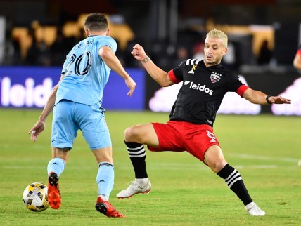 Sep 29, 2021; Washington, District of Columbia, USA; Minnesota United midfielder Jan Gregus (8) possesses the ball as D.C. United midfielder Felipe Martins (8) defends during the first half at Audi Field. Mandatory Credit: Brad Mills-USA TODAY Sports