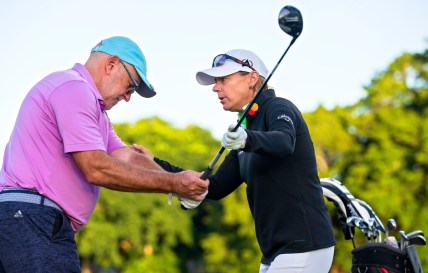 Annika Sorenstam helps Steven Collis with his game during a charity golf clinic presented by Jack Nicklaus, Sorenstam and Ernie Els at PGA National in Palm Beach Gardens Monday, October 4, 2021.