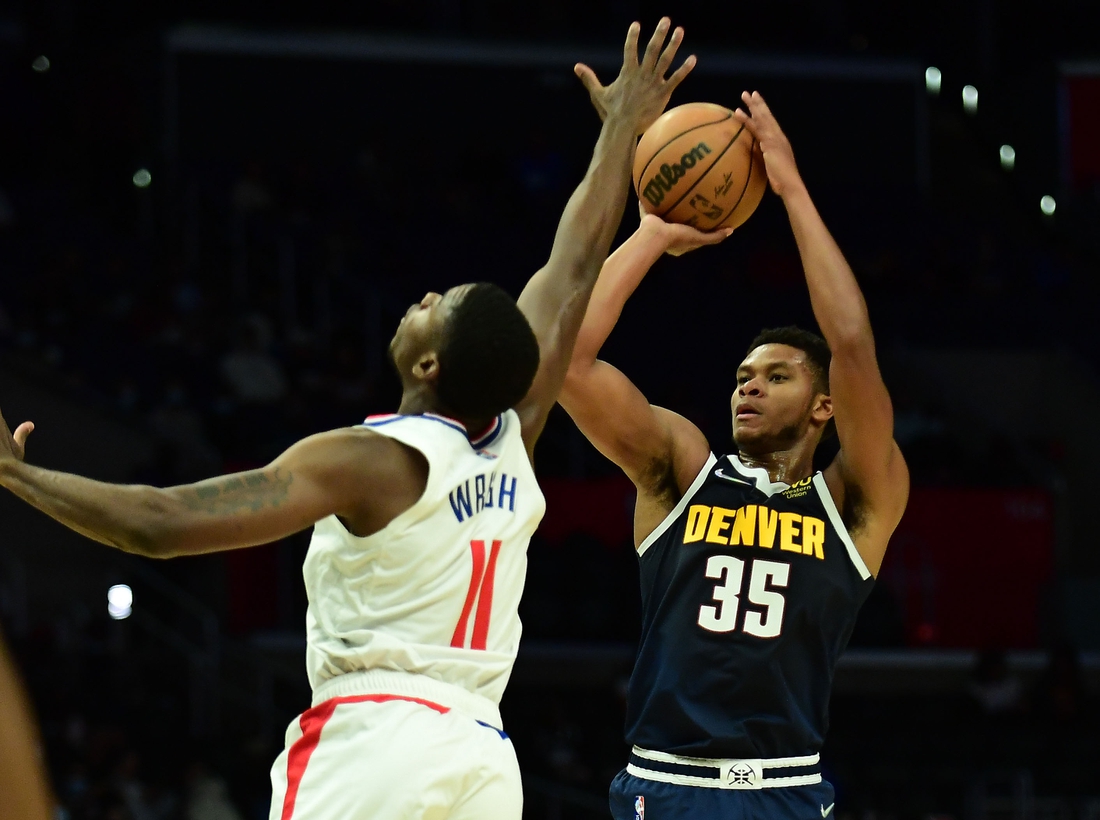 Oct 4, 2021; Los Angeles, California, USA; Denver Nuggets guard PJ Dozier (35) shoots against Los Angeles Clippers forward Moses Wright (11) during the second half at Staples Center. Mandatory Credit: Gary A. Vasquez-USA TODAY Sports