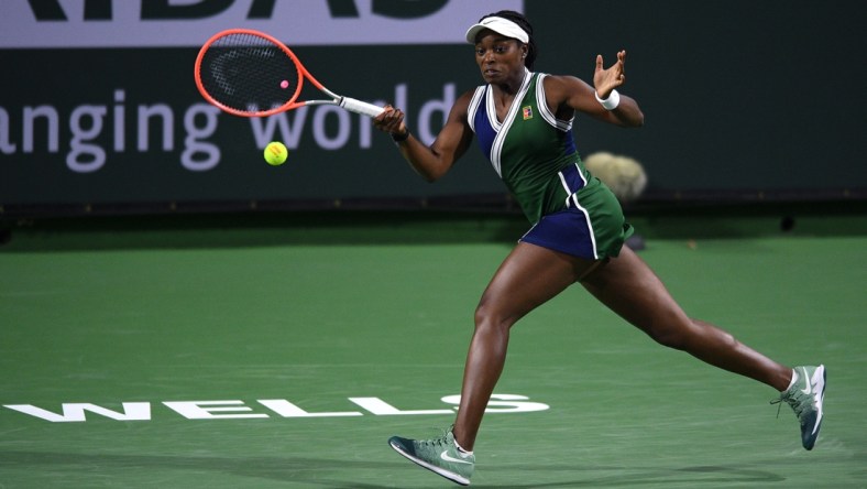 Oct 8, 2021; Indian Wells, CA, USA; Sloane Stephens (USA) hits a shot against Jessica Pegula (USA) at Indian Wells Tennis Garden. Mandatory Credit: Orlando Ramirez-USA TODAY Sports