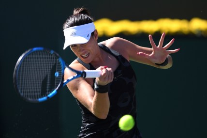 Oct 9, 2021; Indian Wells, CA, USA; Garbine Muguruza (ESP) hits a shot against Ajla Tomljanovic (AUS) at Indian Wells Tennis Garden. Mandatory Credit: Orlando Ramirez-USA TODAY Sports