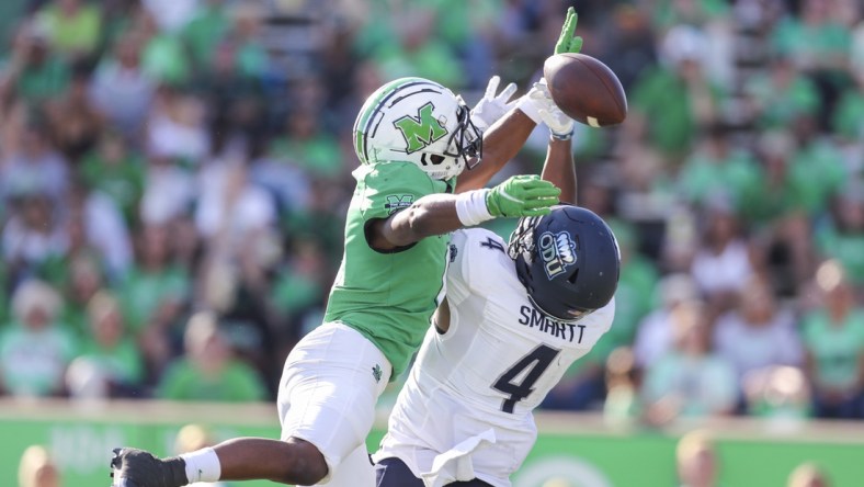 Oct 9, 2021; Huntington, West Virginia, USA; Marshall Thundering Herd defensive back Micah Abraham (6) breaks up a pass intended for Old Dominion Monarchs quarterback Stone Smartt (4) during the third quarter at Joan C. Edwards Stadium. Mandatory Credit: Ben Queen-USA TODAY Sports