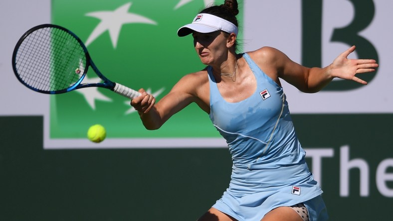 Oct 10, 2021; Indian Wells, CA, USA; Irina-Camelia Begu (ROU) hits a shot against Shelby Rogers (USA) at Indian Wells Tennis Garden. Mandatory Credit: Orlando Ramirez-USA TODAY Sports