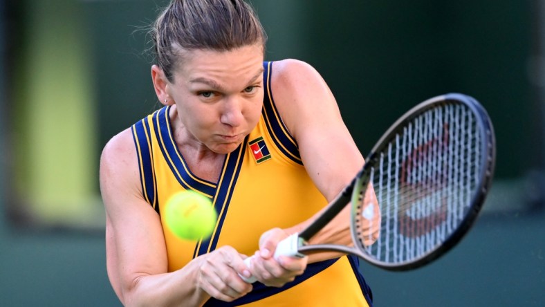 Oct 10, 2021; Indian Wells, CA, USA; Simona Halep (ROU) hits a shot in her second round match against Aliaksandra Sasnovich (BLR) during the BNP Paribas Open at the Indian Wells Tennis Garden. Mandatory Credit: Jayne Kamin-Oncea-USA TODAY Sports