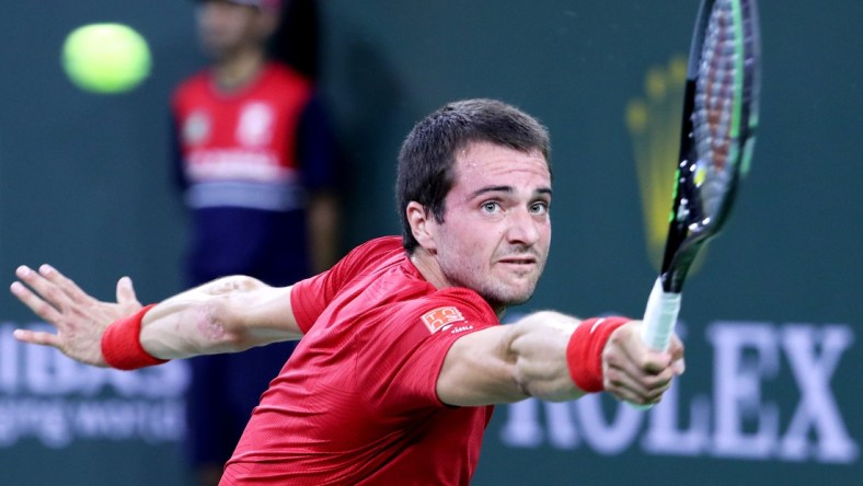 Pedro Martinez of Spain returns a shot to Stefanos Tsitsipas of Greece during the BNP Paribas Open in Indian Wells, Calif., on October 10, 2021.

Stefanos Tsitsipas Vs Pedro Martinez Bnp Paribas2062