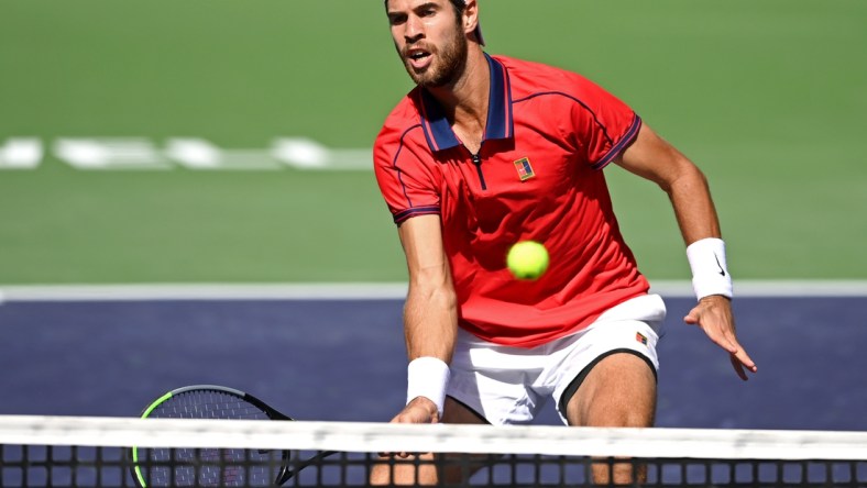 Oct 12, 2021; Indian Wells, CA, USA; Karen Khachanov (RUS) hits a shot against Pablo Carreno Busta (ESP) during a fourth round match in the BNP Paribas Open at the Indian Wells Tennis Garden. Mandatory Credit: Jayne Kamin-Oncea-USA TODAY Sports