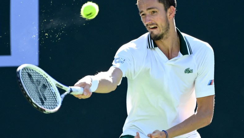 Oct 13, 2021; Indian Wells, CA, USA; Daniil Medvedev (RUS) hits a shot against Grigor Dimitrov (BUL) in his fourth round match during the BNP Paribas Open at the Indian Wells Tennis Garden. Mandatory Credit: Jayne Kamin-Oncea-USA TODAY Sports