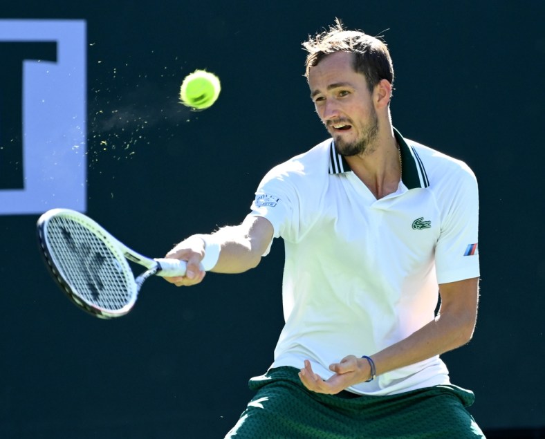 Oct 13, 2021; Indian Wells, CA, USA; Daniil Medvedev (RUS) hits a shot against Grigor Dimitrov (BUL) in his fourth round match during the BNP Paribas Open at the Indian Wells Tennis Garden. Mandatory Credit: Jayne Kamin-Oncea-USA TODAY Sports