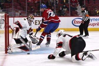 Oct 7, 2021; Montreal, Quebec, CAN; Ottawa Senators goaltender Anton Forsberg (31) makes a save against Montreal Canadiens center Ryan Poehling (25) during the second period at Bell Centre. Mandatory Credit: Jean-Yves Ahern-USA TODAY Sports