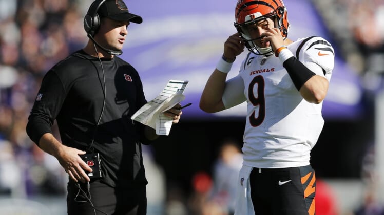 Oct 24, 2021; Baltimore, MD, USA; Cincinnati Bengals quarterback Joe Burrow (9) talks with head coach Zac Taylor during an official review in the third quarter of the NFL Week 7 game between the Baltimore Ravens and the Cincinnati Bengals at M&T Bank Stadium in Baltimore on Sunday, Oct. 24, 2021.  Mandatory Credit: Sam Greene-USA TODAY Sports