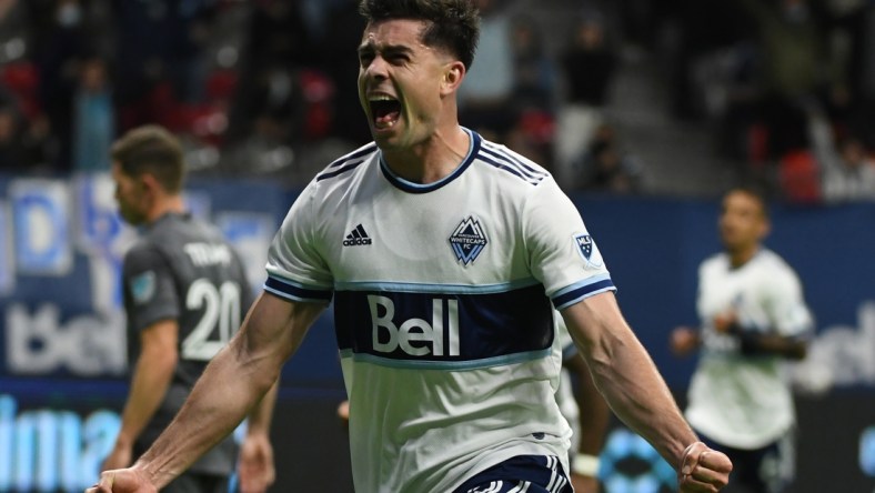 Oct 27, 2021; Vancouver, British Columbia, CAN;  Vancouver Whitecaps forward Brian White (24) scores against Minnesota United FC goalkeeper Tyler Miller (1) (not pictured) during the second half at BC Place. Mandatory Credit: Anne-Marie Sorvin-USA TODAY Sports