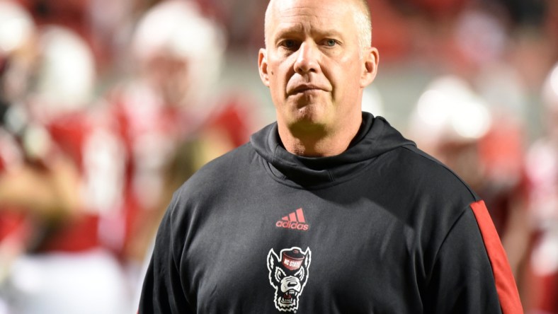 Oct 30, 2021; Raleigh, North Carolina, USA North Carolina State Wolfpack head coach Dave Doeren watches his team warm up prior to a game against the Louisville Cardinals at Carter-Finley Stadium. Mandatory Credit: