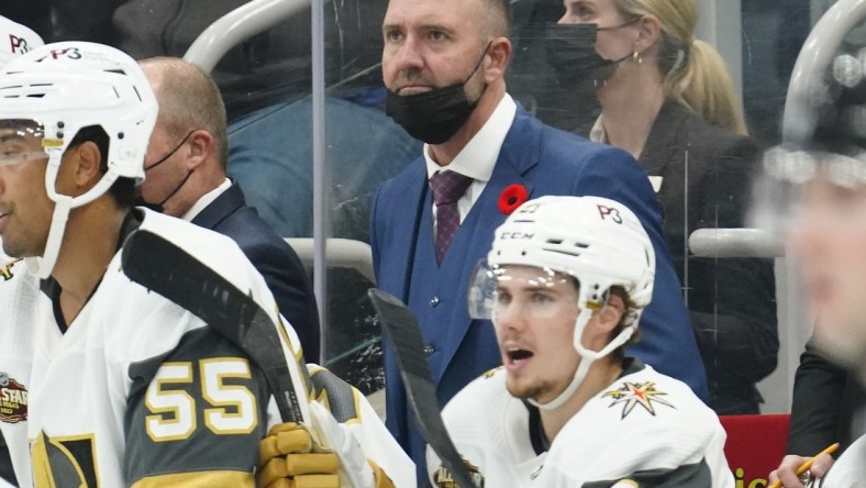 Nov 2, 2021; Toronto, Ontario, CAN; Vegas Golden Knights head coach Peter DeBoer watches the play against the Toronto Maple Leafs at Scotiabank Arena. Mandatory Credit: John E. Sokolowski-USA TODAY Sports