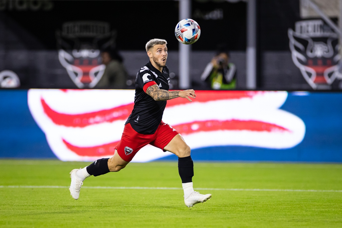 Oct 30, 2021; Washington, District of Columbia, USA; D.C. United forward Paul Arriola (7) chases the ball against the Columbus Crew during the first half of the MLS game at Audi Field. Mandatory Credit: Scott Taetsch-USA TODAY Sports