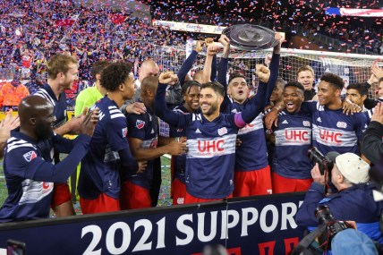 Nov 7, 2021; Foxborough, Massachusetts, USA; New England Revolution forward Gustavo Bou (7) and New England Revolution midfielder Carles Gil (22) celebrate winning the 2021 Supporters  Shield at Gillette Stadium. Mandatory Credit: Paul Rutherford-USA TODAY Sports