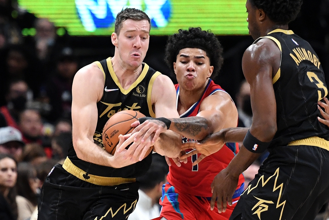 Nov 13, 2021; Toronto, Ontario, CAN; Toronto Raptors guard Goran Dragic (1) battles for the ball with Detroit Pistons guard Killian Hayes (7) in the first half at Scotiabank Arena. Mandatory Credit: Dan Hamilton-USA TODAY Sports