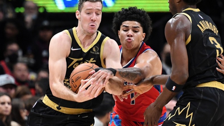 Nov 13, 2021; Toronto, Ontario, CAN; Toronto Raptors guard Goran Dragic (1) battles for the ball with Detroit Pistons guard Killian Hayes (7) in the first half at Scotiabank Arena. Mandatory Credit: Dan Hamilton-USA TODAY Sports