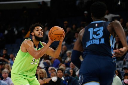 Nov 8, 2021; Memphis, Tennessee, USA; Minnesota Timberwolves center/forward Karl-Anthony Towns (32) shoots for three during the first half against the Memphis Grizzles at FedExForum. Mandatory Credit: Petre Thomas-USA TODAY Sports