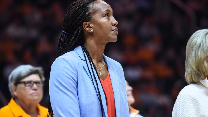 Nov 21, 2021; Knoxville, Tennessee, USA; Former Tennessee Lady Vols player Tamika Catchings watches a video as she is honored at halftime in a game against the Texas Longhorns at Thompson-Boling Arena. Mandatory Credit: Bryan Lynn-USA TODAY Sports