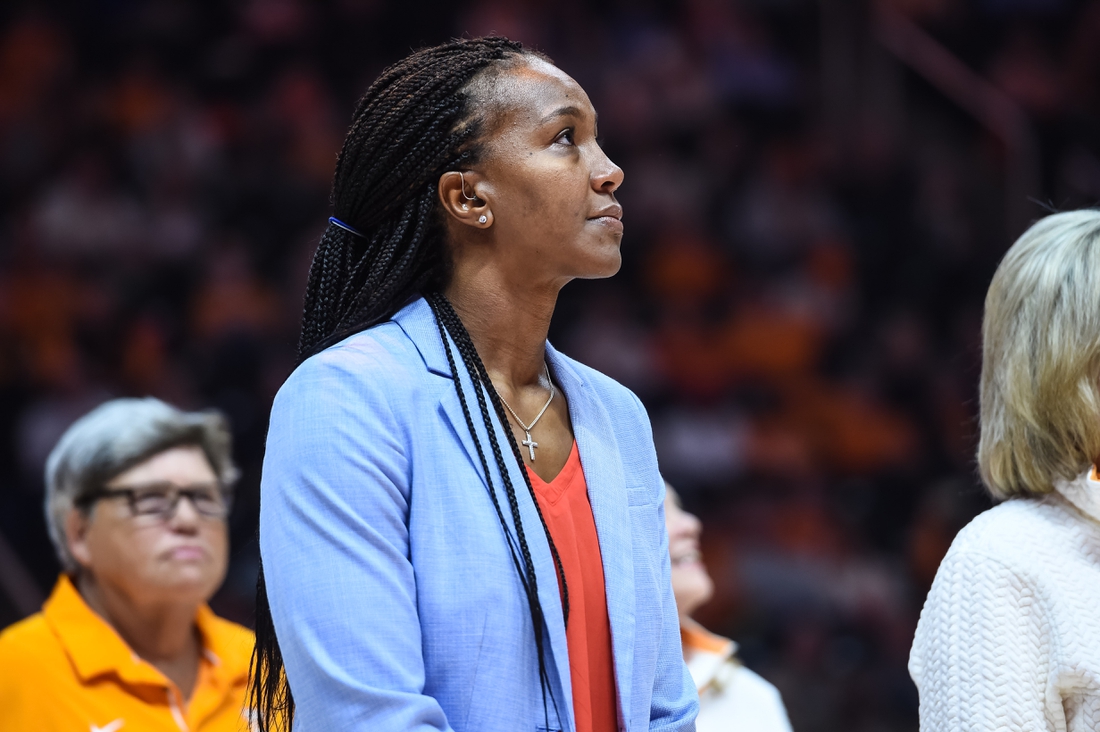 Nov 21, 2021; Knoxville, Tennessee, USA; Former Tennessee Lady Vols player Tamika Catchings watches a video as she is honored at halftime in a game against the Texas Longhorns at Thompson-Boling Arena. Mandatory Credit: Bryan Lynn-USA TODAY Sports