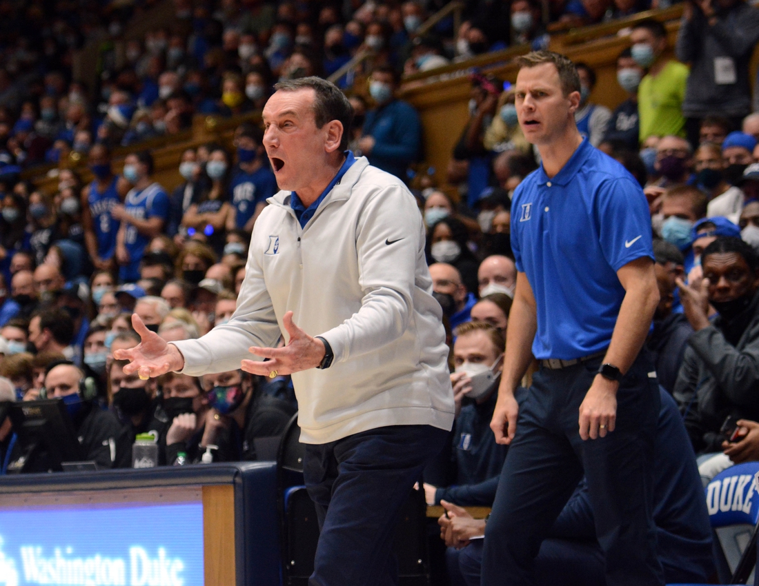 Nov 22, 2021; Durham, North Carolina, USA;  Duke Blue Devils head coach Mike Krzyzewski (left) and associate head coach Jon Scheyer react during the first half against Duke Blue Devils at Cameron Indoor Stadium. Mandatory Credit: Rob Kinnan-USA TODAY Sports