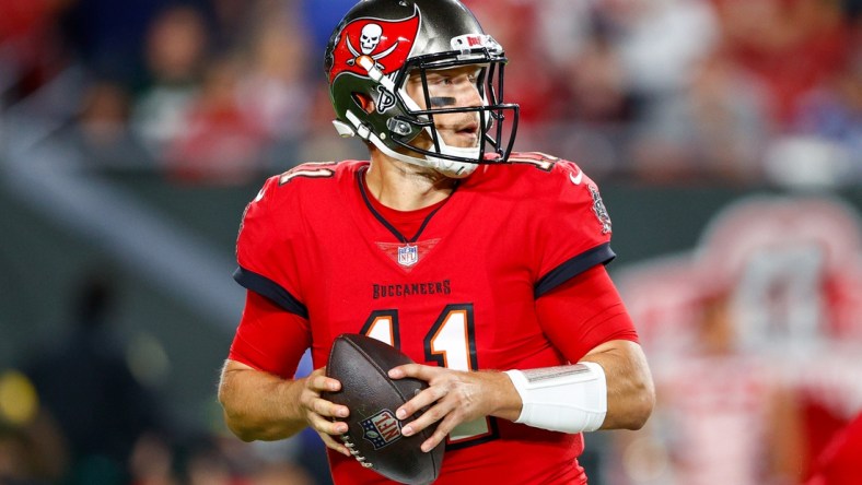 Nov 22, 2021; Tampa, Florida, USA;  Tampa Bay Buccaneers quarterback Blaine Gabbert (11) looks to pass the ball in the second half against the New York Giants at Raymond James Stadium. Mandatory Credit: Nathan Ray Seebeck-USA TODAY Sports