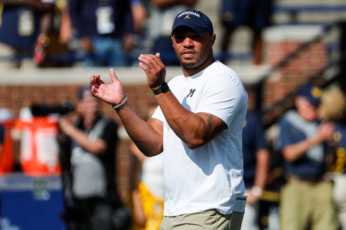 Michigan offensive coordinator Josh Gattis watches warmups before a game against Northern Illinois at Michigan Stadium in Ann Arbor on Saturday, Sept. 18, 2021.