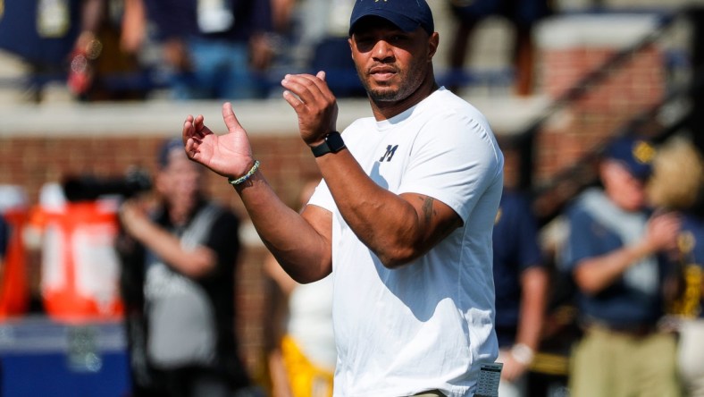 Michigan offensive coordinator Josh Gattis watches warmups before a game against Northern Illinois at Michigan Stadium in Ann Arbor on Saturday, Sept. 18, 2021.