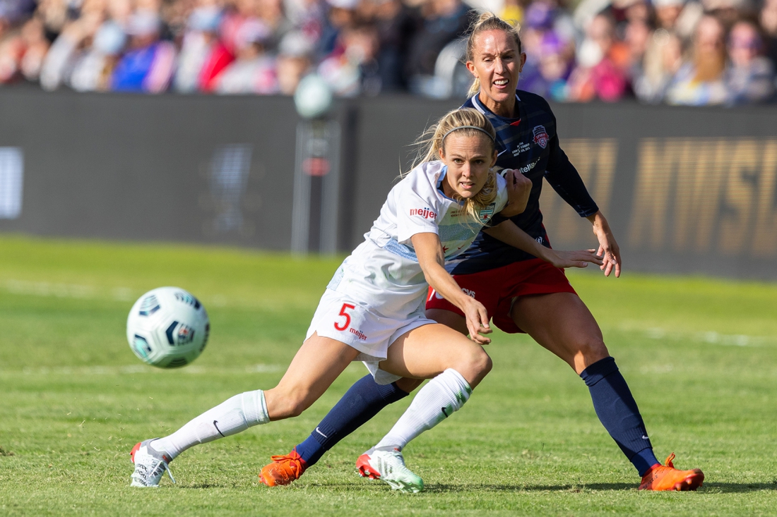 Nov 20, 2021; Louisville, Kentucky, USA; Chicago Red Stars forward Rachel Hill (5) passes the ball against Washington Spirit midfielder Julia Roddar (16) during the NWSL Championship match against the Chicago Red Stars at Lynn Family Stadium. Mandatory Credit: Jordan Prather-USA TODAY Sports